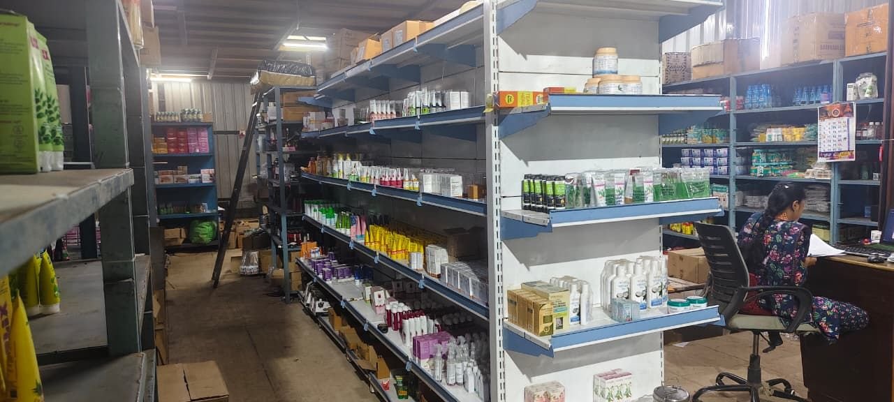 Tulsiram Sitaram & Sons warehouse in Nashik — stocked FMCG racks